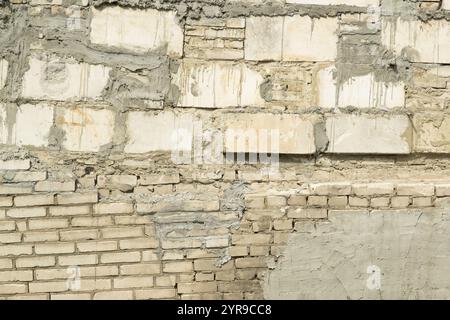 A painted white brick wall featuring a smooth, minimalistic design ideal for modern backgrounds or creative design projects. Stock Photo