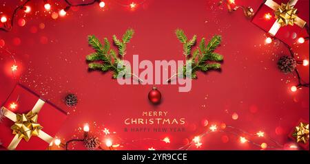 Christmas Red Background - Deer With Green Fir Branches Elements And Gift Boxes - Festive Xmas Flat Top View With Glowing Garland Decorations Stock Photo