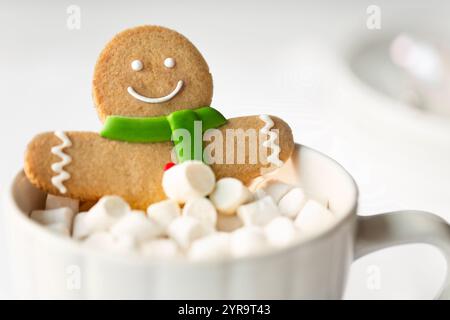 Gingerbread man enjoying a marshmallow bubble bath Stock Photo