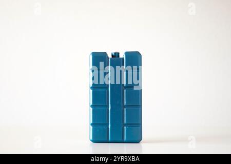 Blue, plastic, freezer or fridge cooling element with gel. Close up studio shot, isolated on white, no people Stock Photo