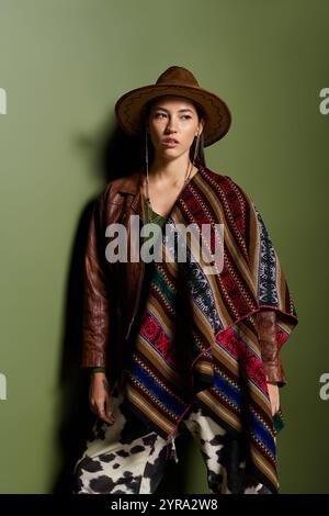 Brunette woman showcases her fashion sense with unique attire while striking a pose indoors. Stock Photo