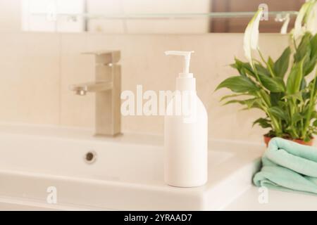 Washing of Hands, Mock up Bottle with Soap or Cream on white Sink, Green Plant. Eco Concept Hygiene Stock Photo