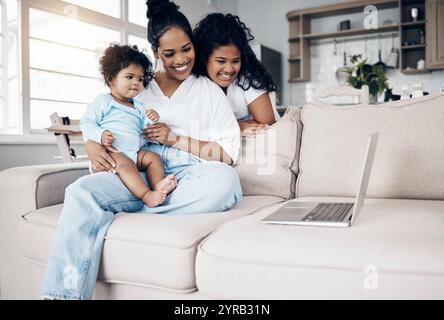 Happy, mother and children with laptop on sofa for watching movies, streaming a film and cartoon entertainment. Woman, girl kids and smile with Stock Photo