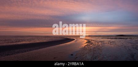 Sunset view of Wadden Sea, with mudflats at low tide on Pinkewad, south of West Frisian island Ameland, Friesland, Netherlands Stock Photo