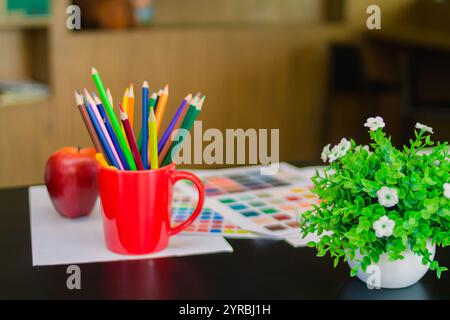 Young designers are choosing color schemes to use in their ux ui website design and working with mobile responsive web developers with ux ui Front End Stock Photo