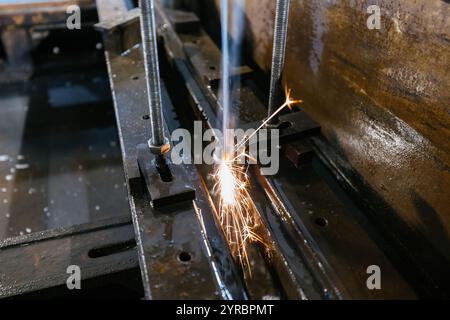 Working plasma cutter with water coolant. Stock Photo