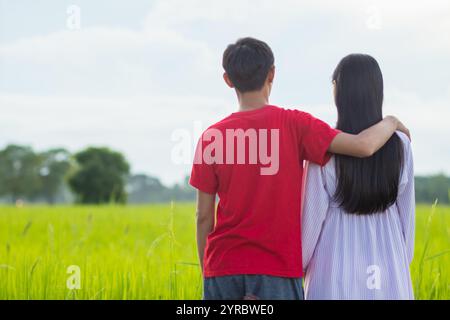 Smooth Focus, young man embraces woman's shoulder to show love and care and promises to care for each other with love and compassion. concept of lovin Stock Photo