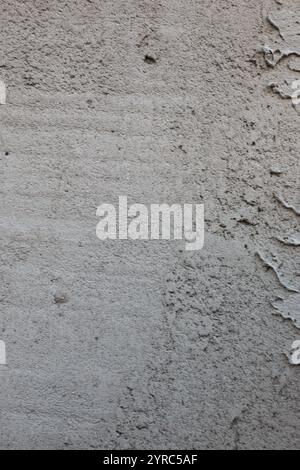 Gray freshly cemented wall close-up. Plaster coating. Stock Photo