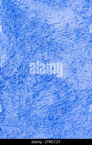 Abstract background of light blue shabby plaster close-up. Stock Photo