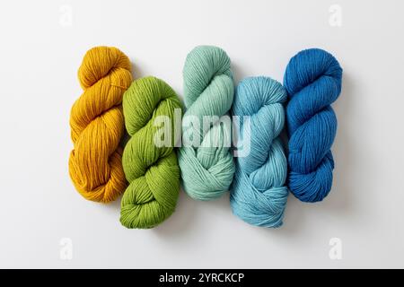 Yarns in different colours on white background. Hobbies and leisure. Stock Photo