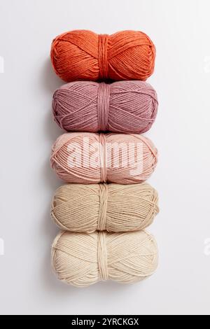 Pastel colored yarn wool on white background. Hobbies and leisure. Stock Photo