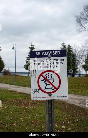 Advisory sign prohibiting outdoor cooking at Innisfil Beach Park in Innisfil, Ontario, Canada Stock Photo