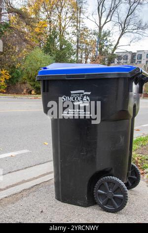 Blue recycling wheelie bin on Innisfil Beach Road in Innisfil, Ontario, Canada Stock Photo