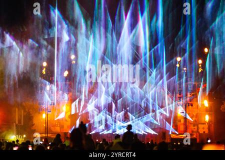 Spectacular bright open air laser show performance at the city festival Stock Photo