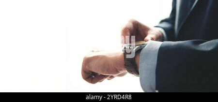 Businessman checking time in office. Businessman with smartwatch, copy space Stock Photo