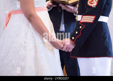 Military Wedding Ceremony Close-Up of Bride and Groom Holding Hands Stock Photo