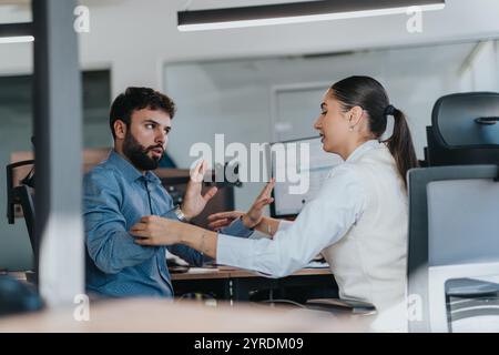 Engaged business discussion between diverse colleagues in modern office Stock Photo