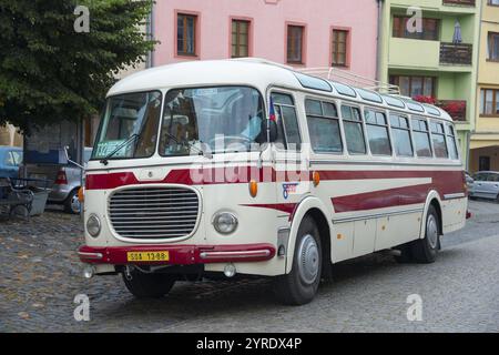 A classic old bus on a cobbled street in a town with colourful buildings, vintage car, Skoda 706 RTO Lux, UTtek, Ustek, Auscha, Ustecky kraj, Lito Stock Photo