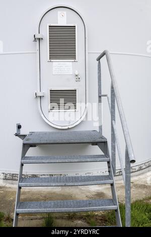 Locked metal gates in the sun Stock Photo