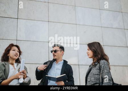 Multicultural business team discussing ideas for growth and success Stock Photo