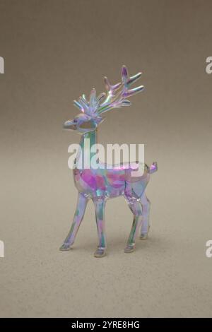 Santas reindeer in vibrant bold gradient holographic colors. Christmas concept art. Minimal New Year surrealism. Stock Photo