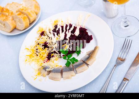 Beetroot served with cheese and pickled mackerel Stock Photo