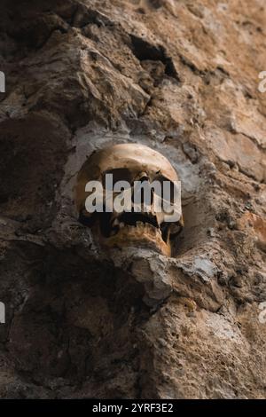 A skull from Cele Kula in Niš, Serbia, part of the Skull Tower, symbolizing history, sacrifice, and a chilling reminder of war and resilience. Stock Photo