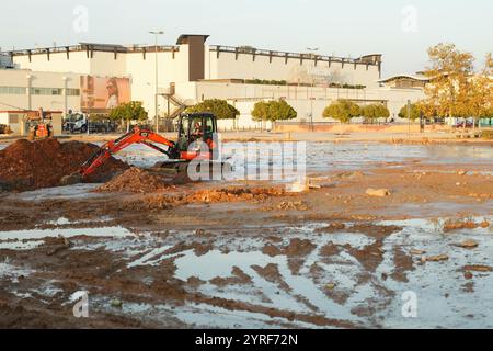 Aldaia, Spain - 3rd December 2024. Mall Shopping Center Bonaire in Aldaia has been one of the most affected area in ground zero of DANA floodings and his underground parking was completely submerged in water stream. Apparently no dead corpses were found and now the firefighters and UME of Spain have pumped out the water and remove damaged cars leaving just mud. The surroundings are still desolate and with destroyed and smashed cars everywhere and reconstruction works proceed slowly. Credit: Roberto Arosio/Alamy Live News Stock Photo