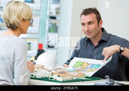 designers sitting at table and working on project Stock Photo