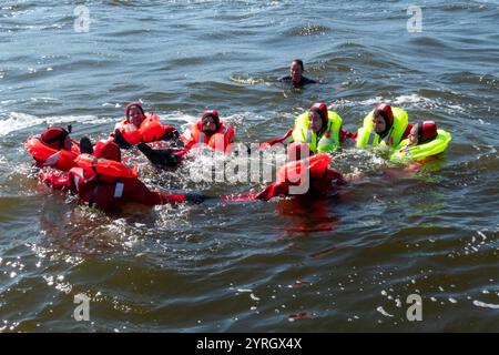 European Space Agency (ESA) astronauts undergoing sea survival training. Photographed in Rostock, Germany, on 8th July 2023. Stock Photo