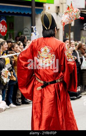 Chinese man parading with fish chinese lamp on Chinese New Year celebration Stock Photo