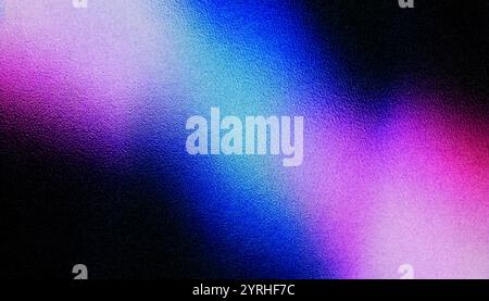 A captivating blend of colors emerges in a grainy texture, presenting soft transitions among shades of blue, pink, and purple, evoking a sense of calm Stock Photo