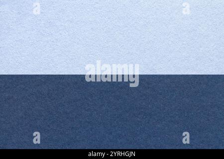 Texture of craft sky and navy blue paper background, half two colors, macro. Structure of vintage dense denim cardboard. Felt backdrop closeup. Stock Photo