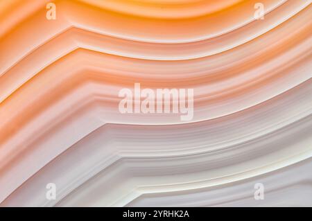 Detailed close-up image showcasing the vibrant and translucent layers of Brazilian agate, beautifully illuminated from behind to highlight its natural Stock Photo