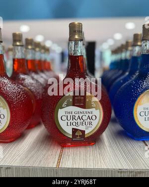 Bottles of Curacao liqueur on sale at a duty free store at Curacao airport. Stock Photo