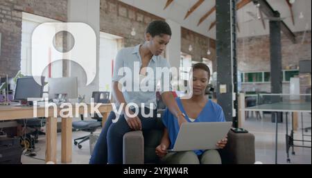Image of ai chat and icons over biracial female colleagues discussing work in office Stock Photo