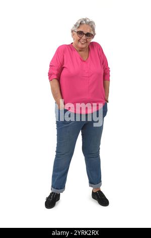 full portrait of senior woman with hands on pockets on white background Stock Photo