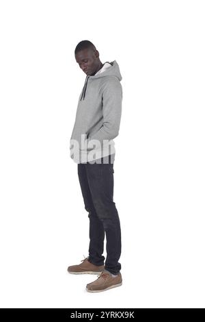 side view portrait of a man standing and look down on white background Stock Photo