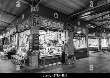 Seville, Spain-FEB 24, 2022: People shopping inside the Mercado de Triana, a covered food market in Triana district of Sevilla, Spain. Stock Photo