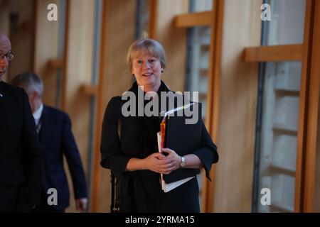 Finance Secretary Shona Robison arrives at the main chamber for the