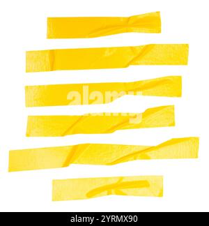 Top view set of wrinkled or crumpled yellow adhesive vinyl tape or cloth tape in stripes shape is isolated on white background with clipping path. Stock Photo
