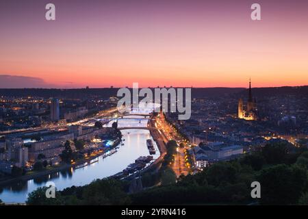 France, Normandy Region, Seine-Maritime Department, Rouen, elevated city view with Cathedral and Seine River, dusk Stock Photo