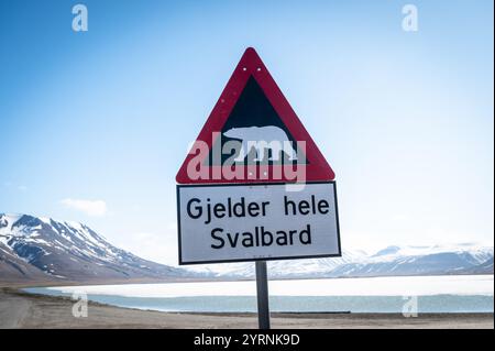 Polar bear warning sign, sign at the exit of Longyearbyen. Behind this sign you are only allowed to walk with a guide with a gun, Spitsbergen, Svalbar Stock Photo