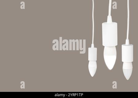 Three light bulbs hanging on beige grey background Stock Photo