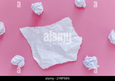 Torn crumpled paper with crumpled paper on a pink background. Free copy space for design and text. Note Stock Photo