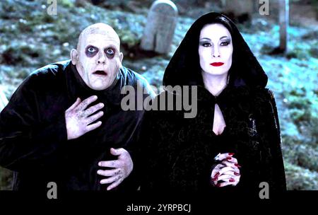 THE ADDAMS FAMILY 1991  Paramount Pictures film with Anjelica Huston as Morticia Addams and Christopher Lloyd as Uncle Fester Addams Stock Photo