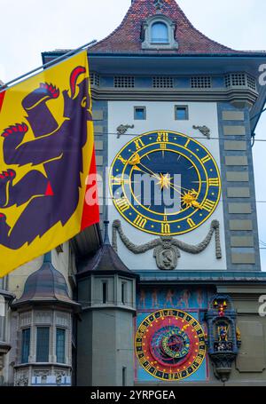 The Clock Tower (Zytglogge) and an Astronomical Clocks and a Flag on the Main Street in Old Town in City of Bern, Canton Bern, Switzerland. Stock Photo