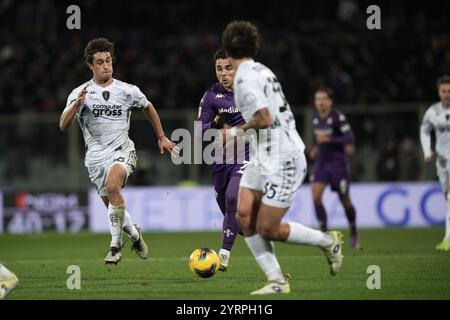 Firenze, Italia. 04th Dec, 2024. Fiorentina's Riccardo Sottil fights for the ball with Empoli's Luca Belardinelli and Empoli's Luca Marianucci during the Round of 16 Frecciarossa Italian Cup 2024/2025 match between Fiorentina and Empoli at Artemio Franchi stadium - Sport, Soccer - Florence, Italy - Wednesday December 4, 2024 (Photo by Massimo Paolone/LaPresse) Credit: LaPresse/Alamy Live News Stock Photo