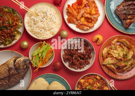 Traditional Chinese New Year dishes with Christmas decorations Stock Photo