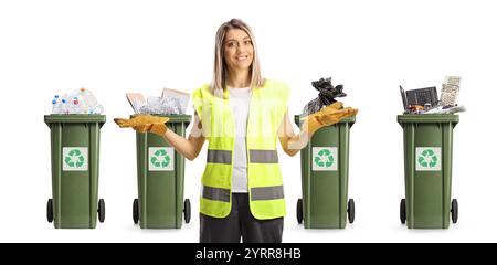 Female waste collector in front of bins for recycling isolated on white background Stock Photo